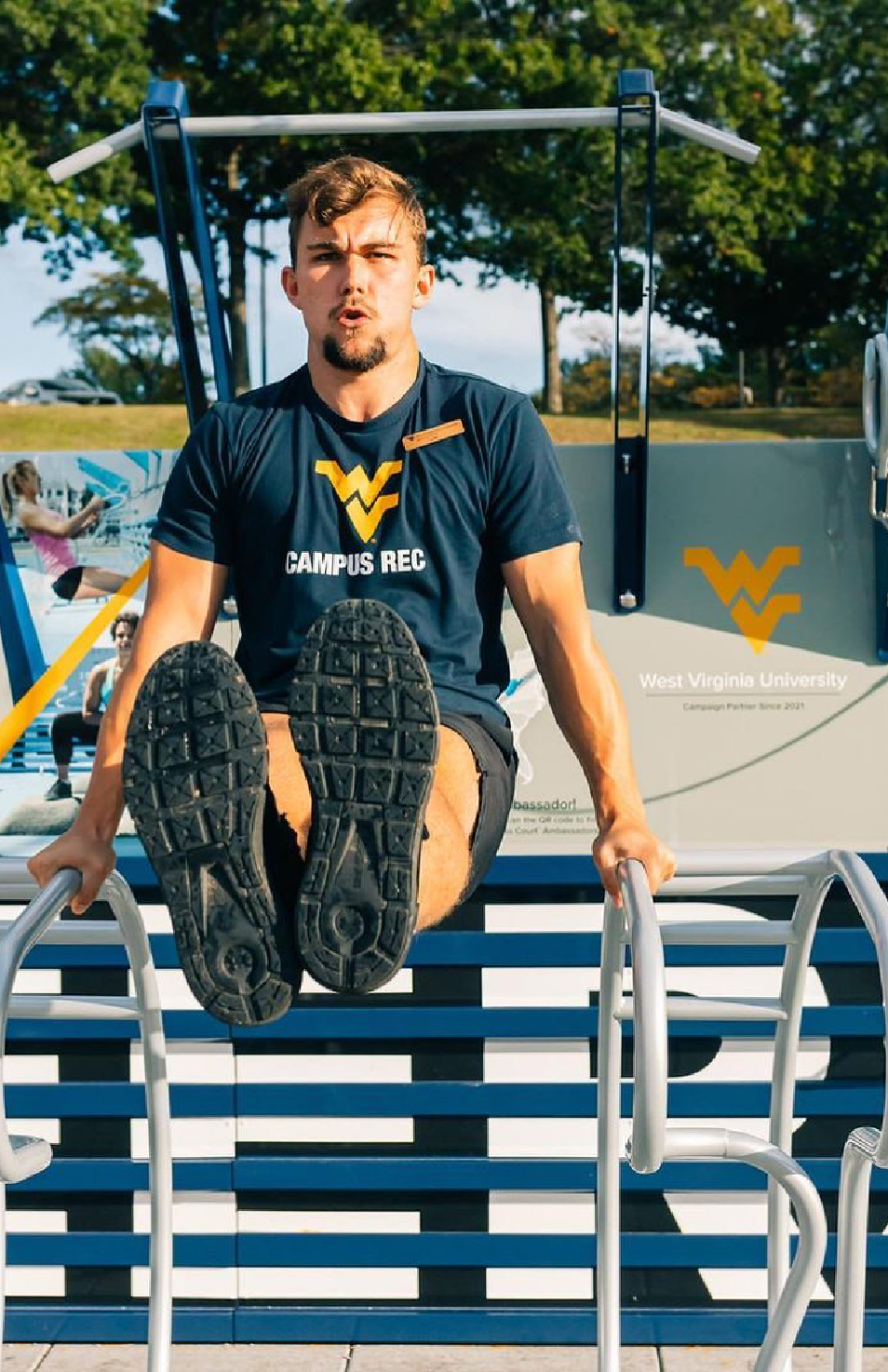 man doing exercise on the pull station at the Fitness Court